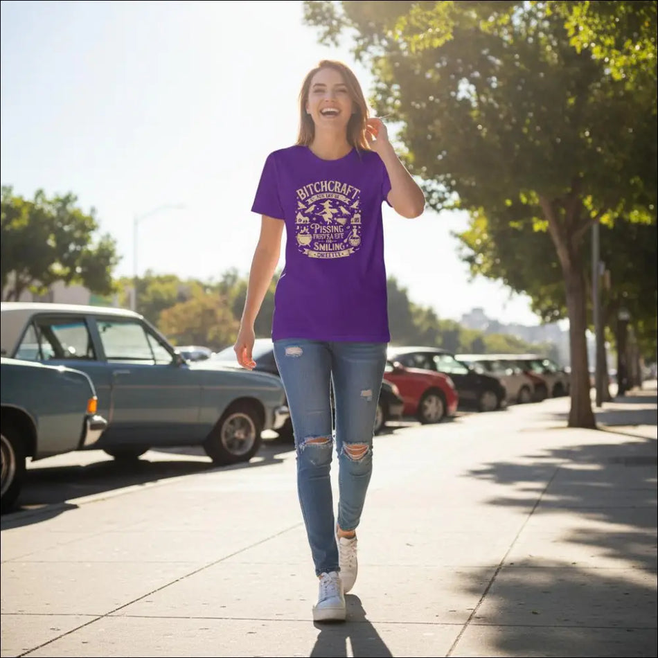 Purple short-sleeved Bitchcraft tee with white text and witchy graphics