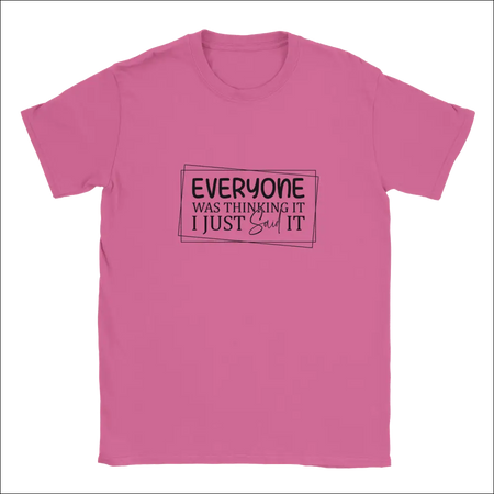 Pink short-sleeved Everyone Was Thinking It unisex t-shirt with black printed phrase in rectangular outline
