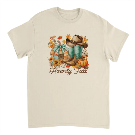 Cream-colored cotton Howdy Fall Western t-shirt with turquoise cowboy boots, brown hat, and pumpkins amid autumn leaves