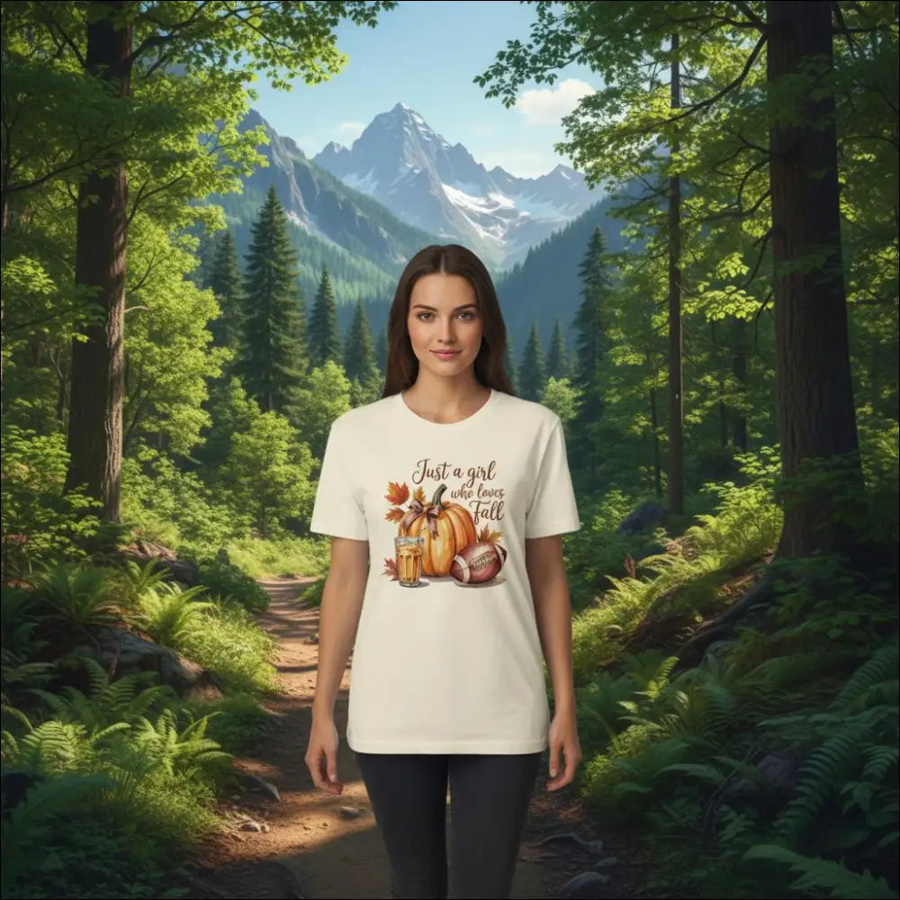 Cream-colored cotton t-shirt with fall graphic of pumpkins, leaves, football