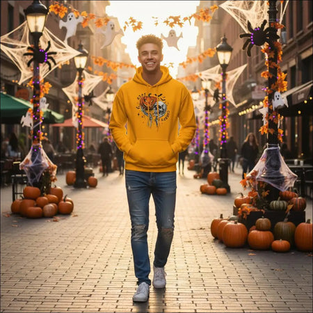 Stay Creepy unisex hoodie with yellow pumpkin skull graphic