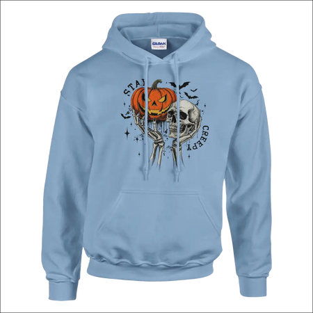 Light blue Gildan Stay Creepy unisex hoodie with pumpkin skull graphic
