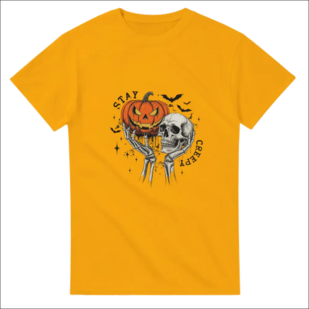 Stay Creepy Unisex Heavy Cotton T-Shirt with jack-o’-lantern and skull graphic