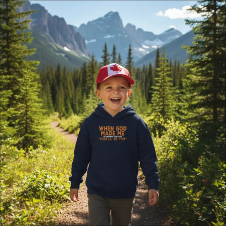 Navy blue kids hoodie with orange When God Made Me text and red Canadian flag cap