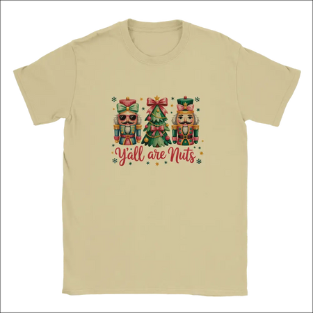 Beige short-sleeved unisex t-shirt with nutcrackers, Christmas tree, and Y’all Are Nuts graphic