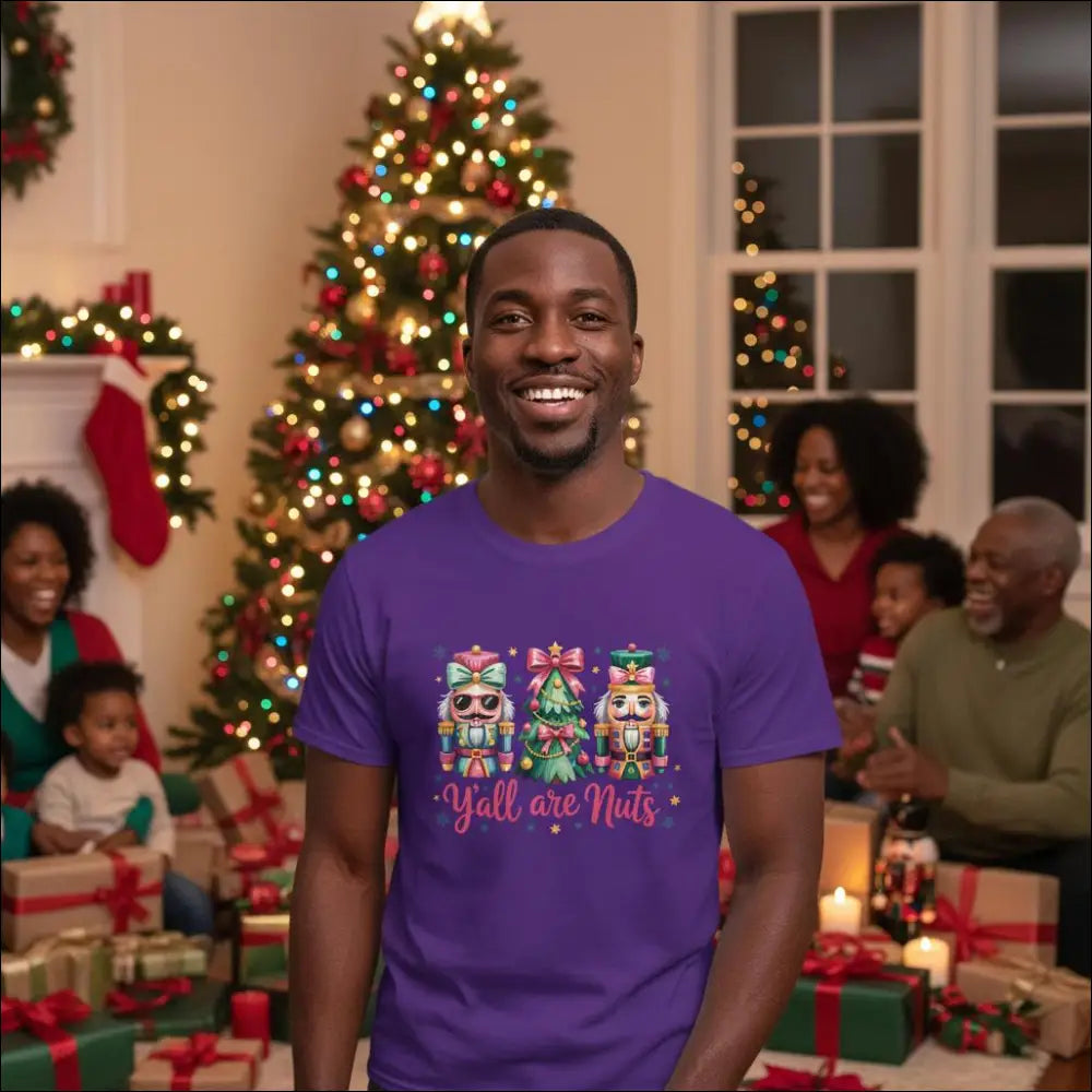 Purple short-sleeved Y’all Are Nuts Christmas t-shirt with nutcrackers, tree, pink text