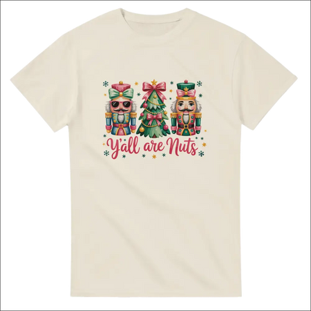 Cream-colored short-sleeved t-shirt with nutcrackers, Christmas tree, and yall are nuts text